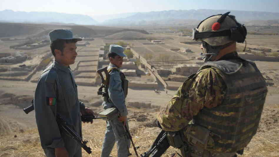 An Italian soldier (right) with Afghan army soldiers at NATO's Combat Outpost Cavour. An Italian soldier (right) with Afghan army soldiers at NATO's Combat Outpost Cavour.