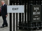 A man leaves the Bank of Ireland in Dublin, on November 15, 2010. A man leaves the Bank of Ireland in Dublin, on November 15, 2010.