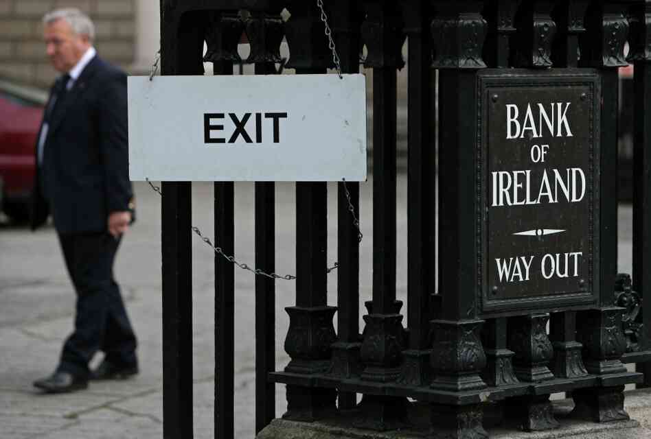 A man leaves the Bank of Ireland in Dublin, on November 15, 2010. A man leaves the Bank of Ireland in Dublin, on November 15, 2010.