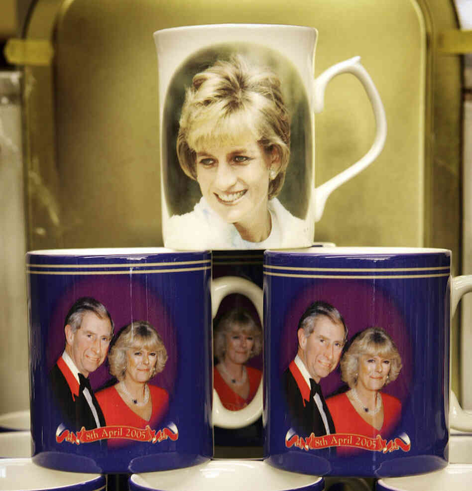 Souvenir mugs honored the late Princess Diana and well as Prince Charles and Camilla Parker-Bowles. Souvenir mugs honored the late Princess Diana and well as Prince Charles and Camilla Parker-Bowles.