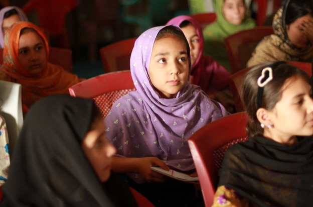Young girls learn how to converse in English at the Afghan-Canadian Community Center in Kandahar.