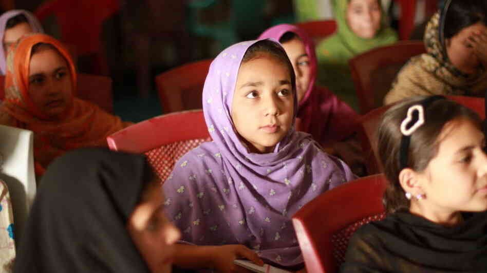 Young girls learn how to converse in English at the Afghan-Canadian Community Center in Kandahar.