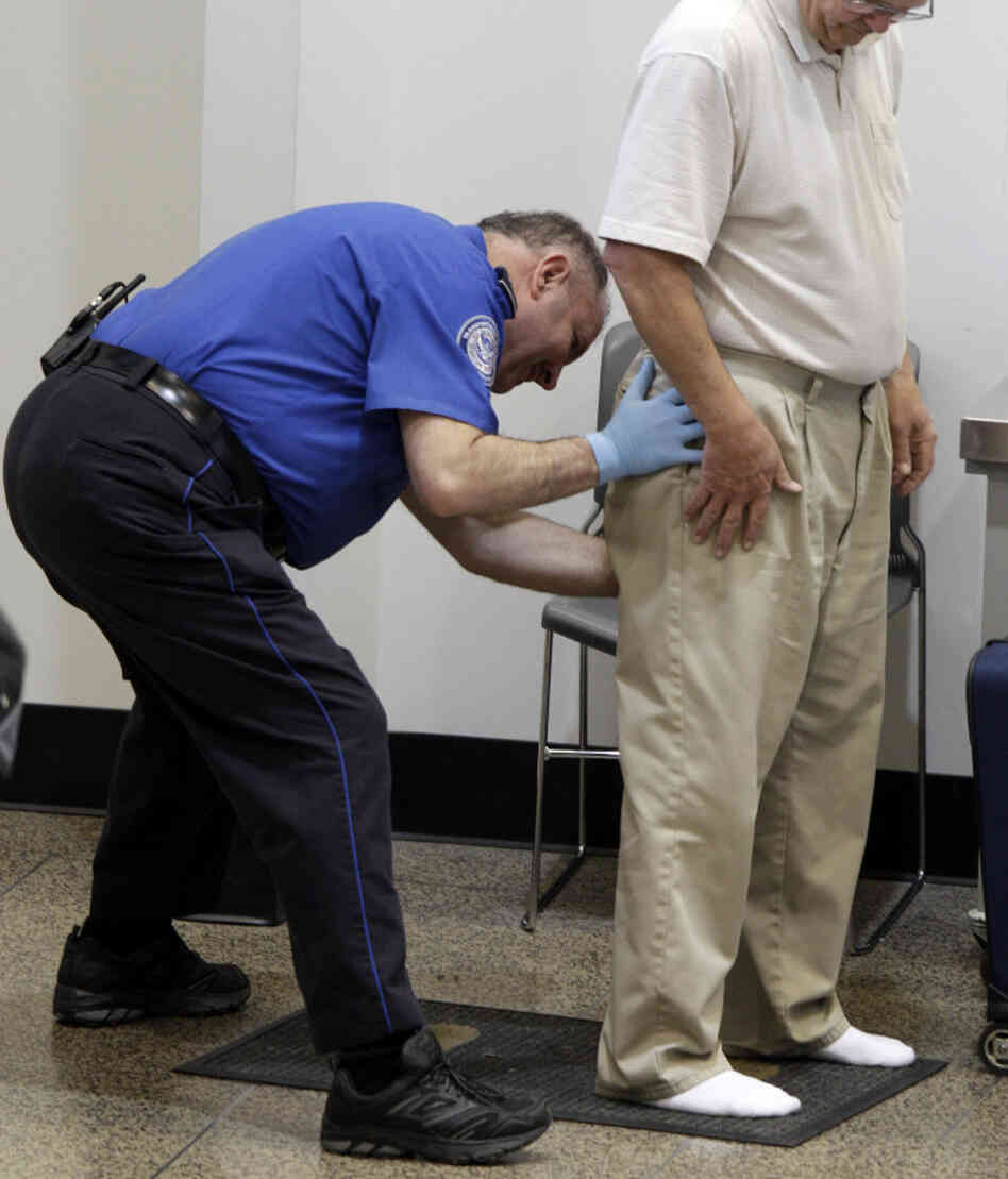 Nov. 19, 2010: A man gets patted down at Seattle-Tacoma International Airport. Nov. 19, 2010: A man gets patted down at Seattle-Tacoma International Airport.