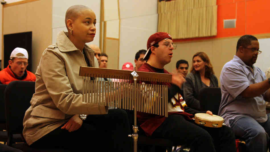 Sharon Adams, 40, plays a bell tree during a recent rehearsal of the interPLAY orchestra Sharon Adams, 40, plays a bell tree during a recent rehearsal of the interPLAY orchestra