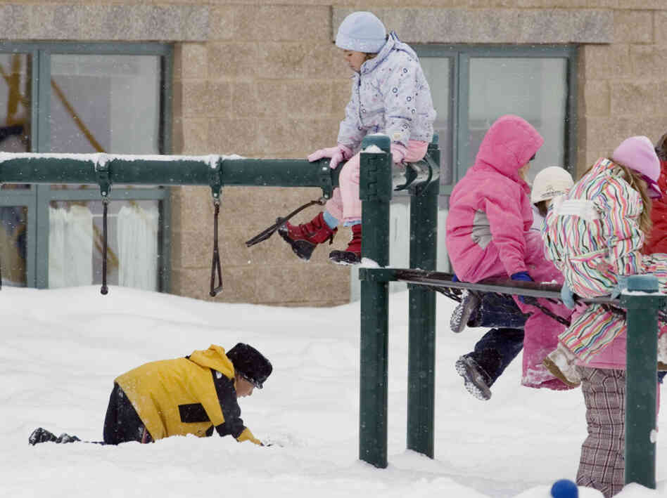 Students playing in the snow Students playing in the snow