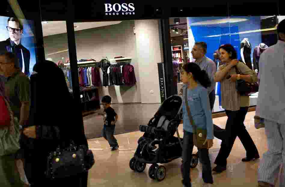Shoppers walk past the Boss store at Citystars. In addition to upscale shopping, the Citystars complex also features three hotels, and residential and office towers.