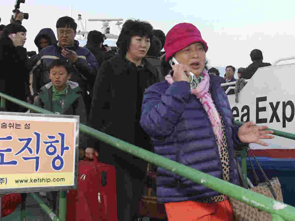 People from Yeonpyeong island arrived at Incheon port west of Seoul after fleeing the bombardment. People from Yeonpyeong island arrived at Incheon port west of Seoul after fleeing the bombardment.