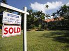 A sold sign in Coral Gables, FL. A sold sign in Coral Gables, FL.