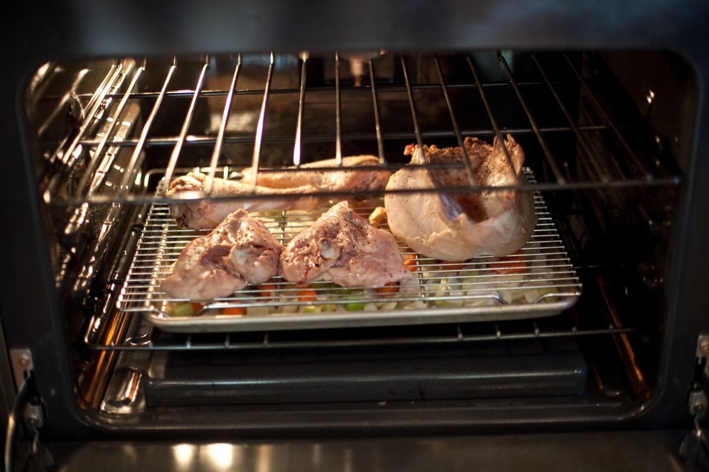 Kimball suggests slow-roasting turkey pieces over a baking sheet of onion, celery, carrot, thyme, garlic and broth.