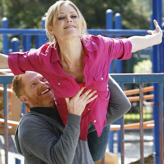 Claire and Mitchell re-enact an ice skating routine.