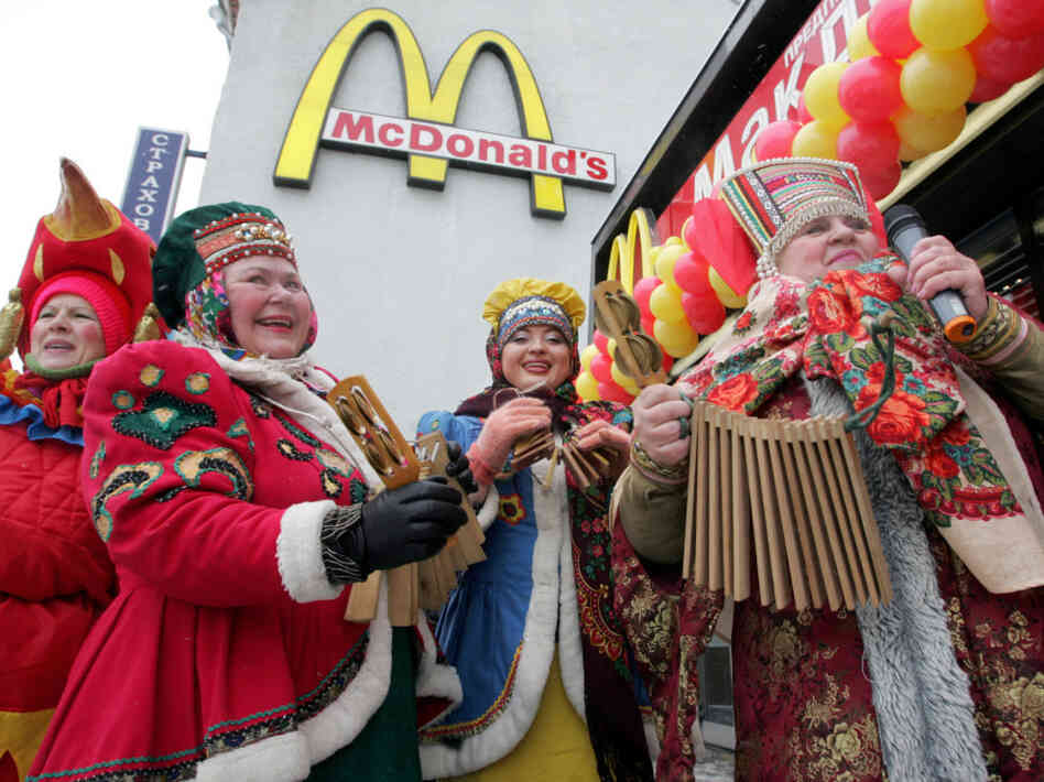 Traditionally dressed Russian musicians perform in front of Pushkin Square McDonald's Traditionally dressed Russian musicians perform in front of Pushkin Square McDonald's