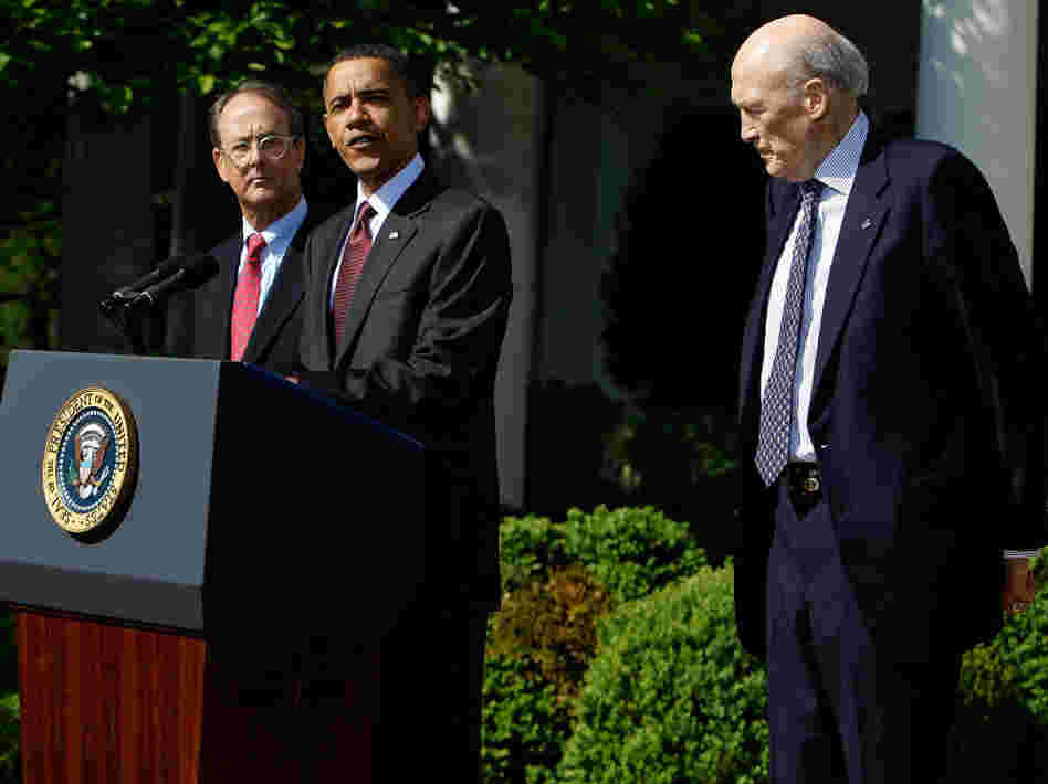 President Obama speaks in the Rose Garden as Erskine Bowles and Alan Simpson listen.