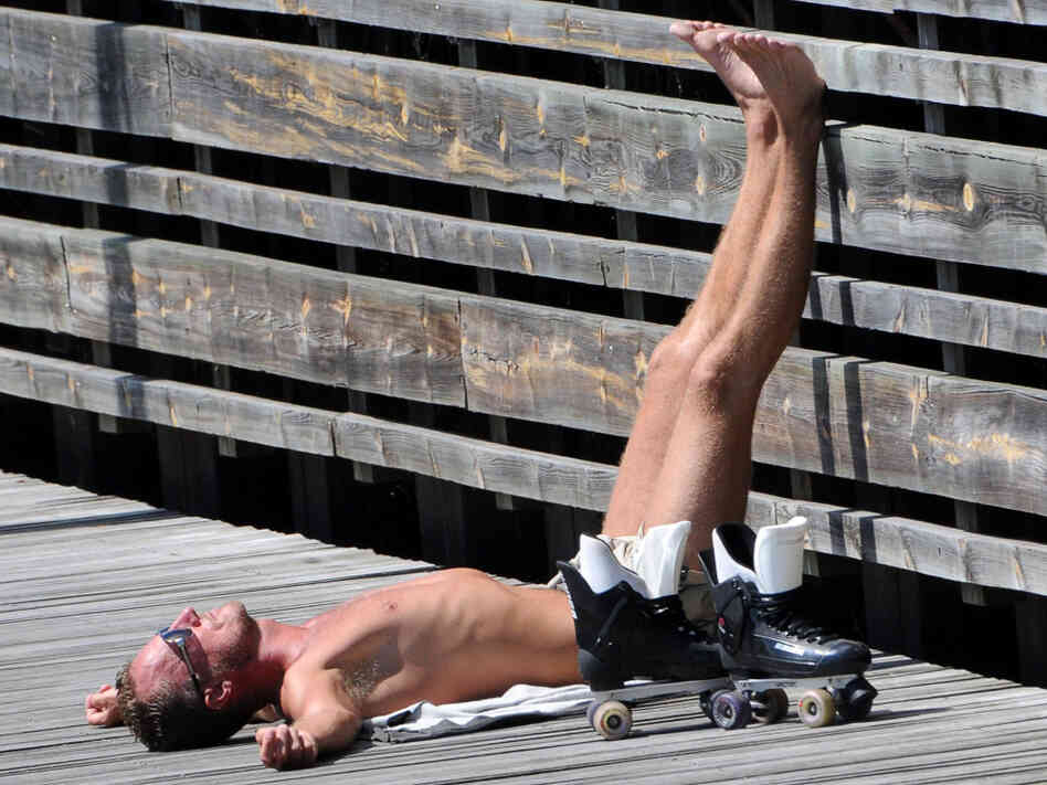 A man sunbathes in Malmo on July 8, 2010. A man sunbathes in Malmo on July 8, 2010.