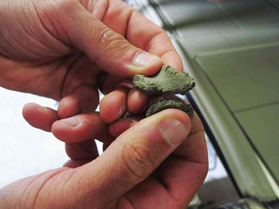 The waste is crushed to a sandy consistency and mixed to form clay.