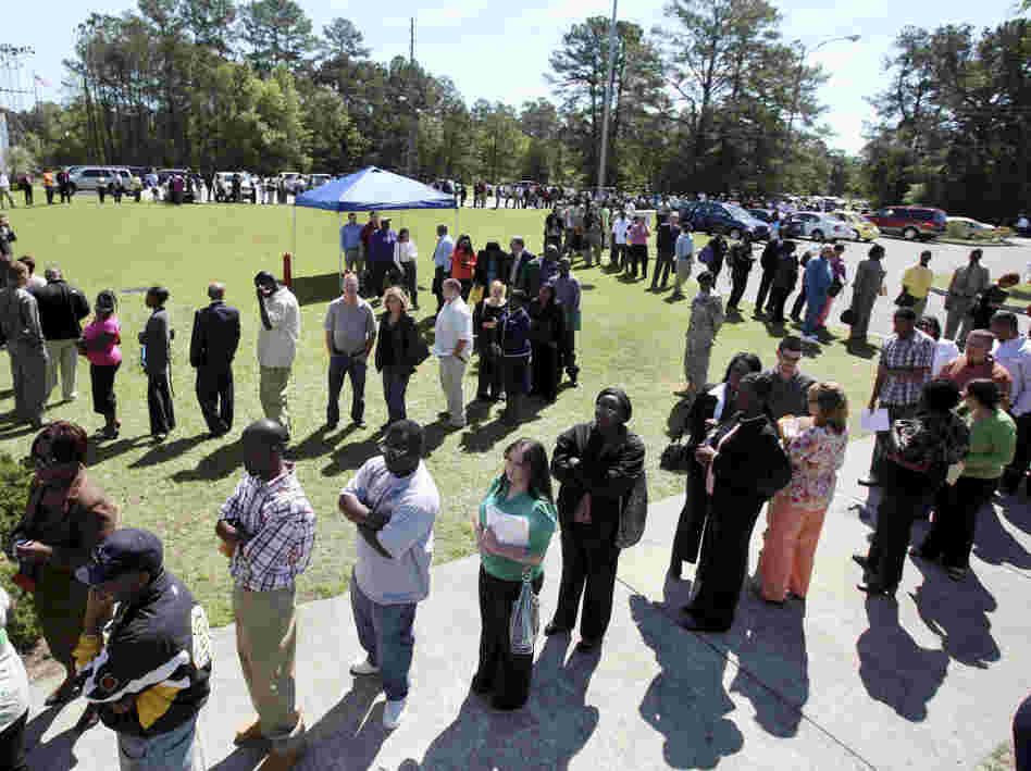 Job applicants stand in a line in Hanahan, S.C., in 2009 as they wait to get into a job fair. Job applicants stand in a line in Hanahan, S.C., in 2009 as they wait to get into a job fair.