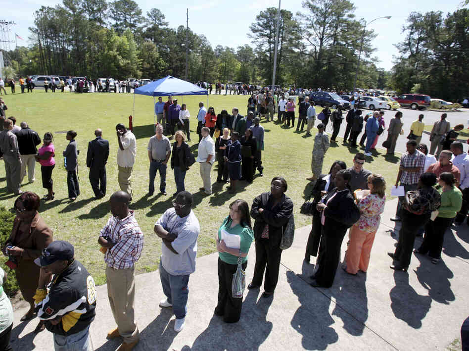 Job applicants stand in a line in Hanahan, S.C., in 2009 as they wait to get into a job fair. Job applicants stand in a line in Hanahan, S.C., in 2009 as they wait to get into a job fair.