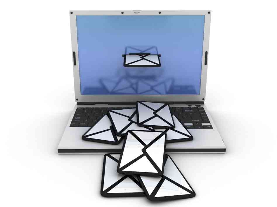 Laptop computer with envelopes spilling from the screen onto the keyboard. Laptop computer with envelopes spilling from the screen onto the keyboard.