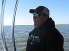 Oysterman Mitch Jurisich steers a small boat around his family's oyster beds. Oysterman Mitch Jurisich steers a small boat around his family's oyster beds.