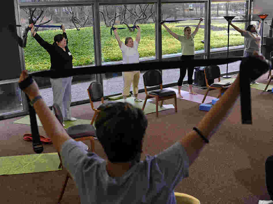 Patients with chronic diseases at the Cleveland Clinic learn to manage their pain using yoga and breathing. Patients with chronic diseases at the Cleveland Clinic learn to manage their pain using yoga and breathing.