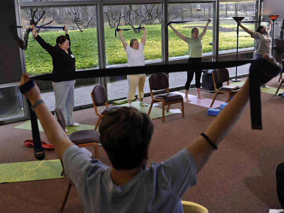 Patients with chronic diseases at the Cleveland Clinic learn to manage their pain using yoga and breathing. Patients with chronic diseases at the Cleveland Clinic learn to manage their pain using yoga and breathing.