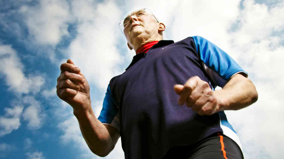 70-year-old man runs outdoors. 70-year-old man runs outdoors.