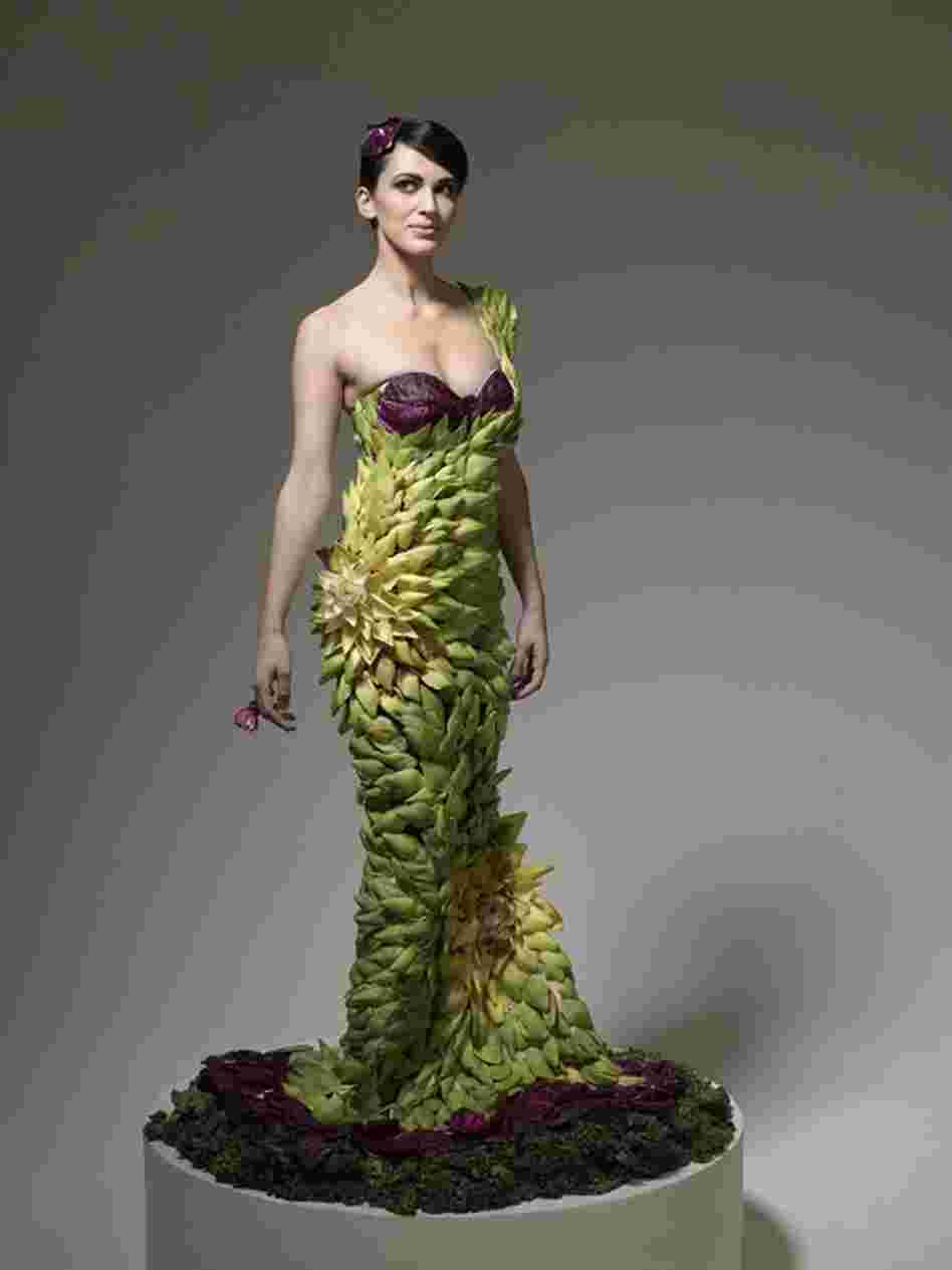 The artichoke gown was designed by Daniel Feld and Wesley Nault of Project Runway fame. It took over 6 hours to finish (the model stood the entire time while they attached each, individual leaf).