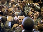 Obama with troops. Jim Watson/AFP/Getty Images Obama with troops. Jim Watson/AFP/Getty Images