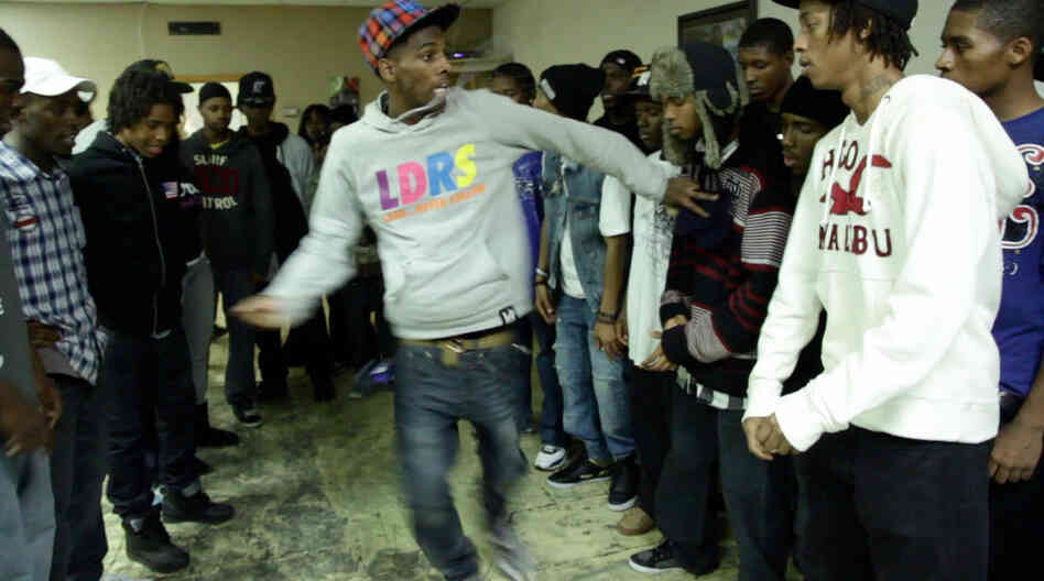 A dancer from the group "Leaders Of The New School" battles in the center of the circle.