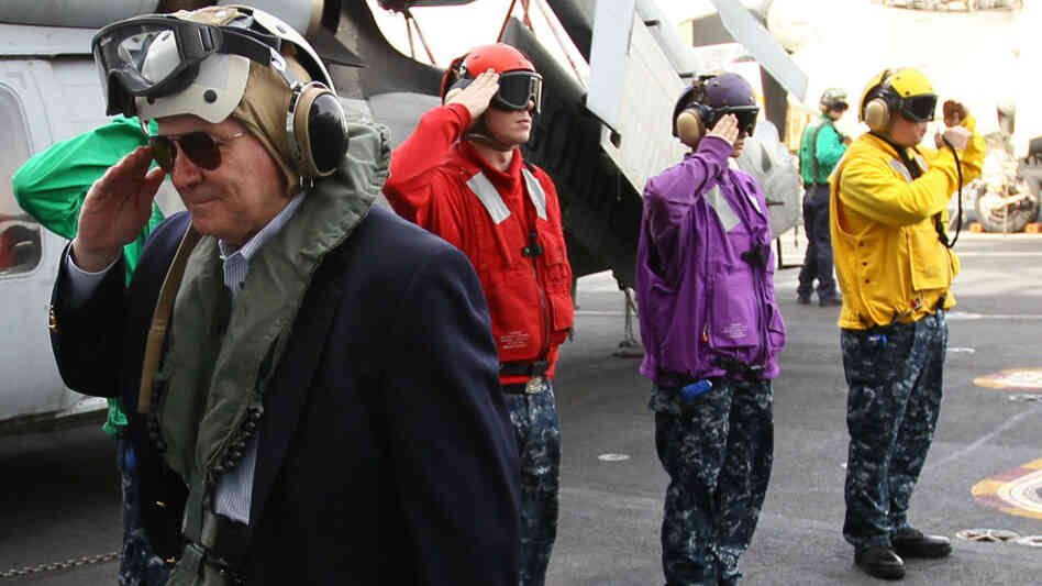 Defense Secretary Robert Gates salutes as he arrives aboard the USS Abraham Lincoln. Defense Secretary Robert Gates salutes as he arrives aboard the USS Abraham Lincoln.