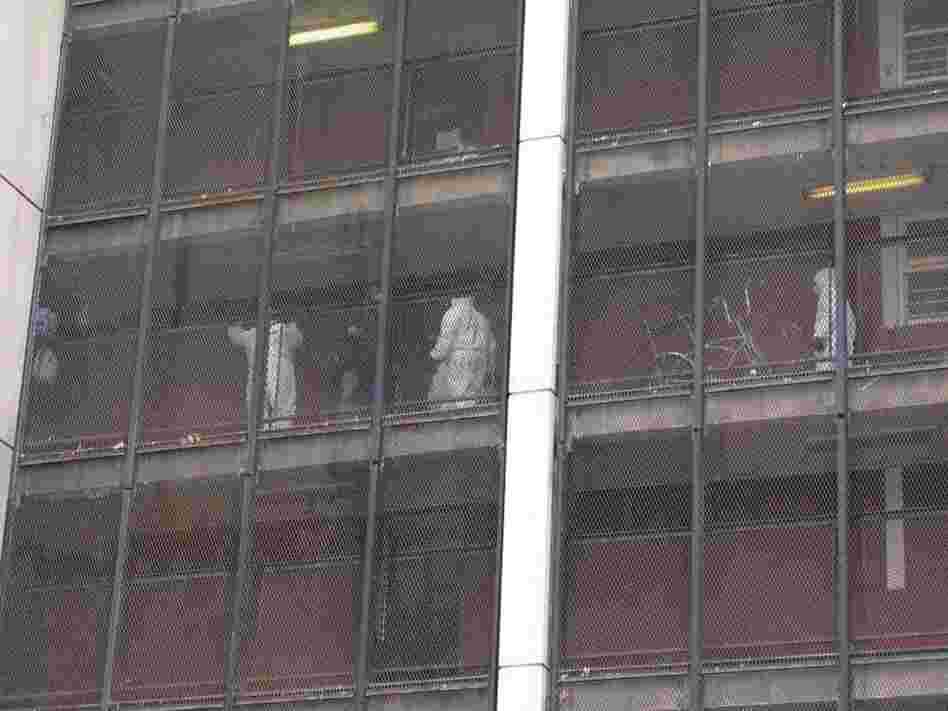 Chicago Housing Authority workers clean out the apartments of residents who have already moved out. Chicago Housing Authority workers clean out the apartments of residents who have already moved out.