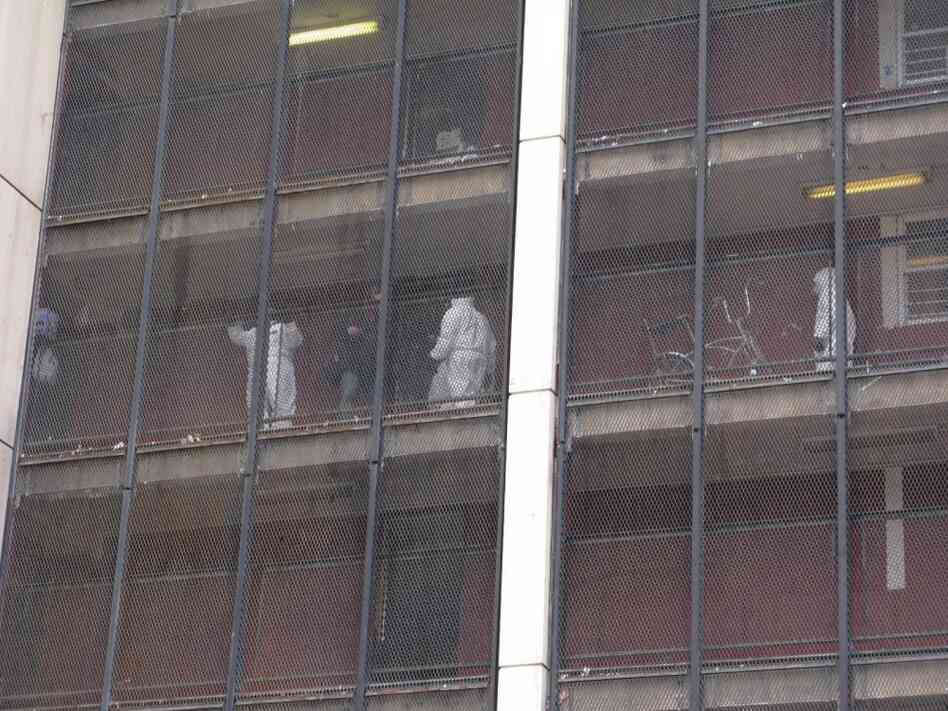 Chicago Housing Authority workers clean out the apartments of residents who have already moved out. Chicago Housing Authority workers clean out the apartments of residents who have already moved out.