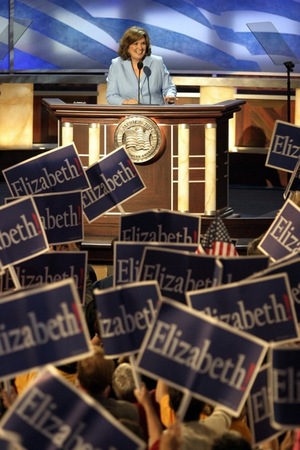 Throughout her life, Edwards wrote publicly about her struggles, including the death of her teenage son, and her failed marriage to Sen. John Edwards. Here, she is greeted by the Democratic National Convention in Boston, in July 2004.