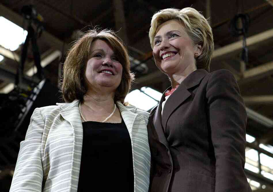 Edwards stands with Sen. Hillary Clinton during a Kerry/Edwards breakfast reception in New York in 2004. 