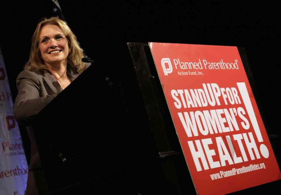 Edwards smiles during a speech at the Planned Parenthood Action Fund conference in Washington, on July, 17, 2007. 