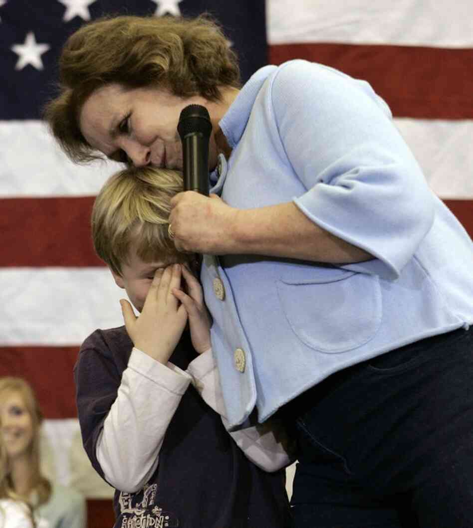 Edwards hugs son Jack onstage after he was too embarrassed to talk in Ames, Iowa, Jan. 1, 2008. 