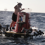 Swimmers prepare Alvin for a dive in the Gulf of Mexico