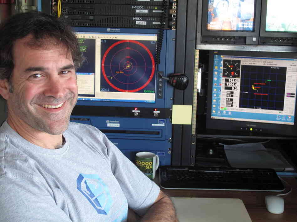 Bruce Strickrott is in charge of Alvin's operations. Here, he monitors a dive from Alvin's control center aboard Atlantis.