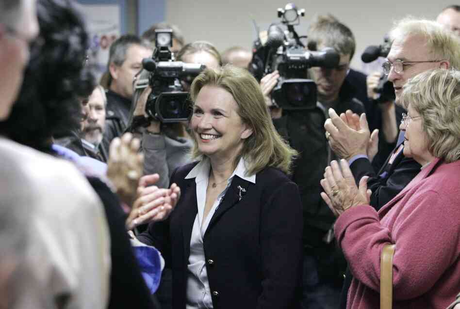Edwards is greeted by supporters before speaking at the official opening of the "Edwards for President" campaign headquarters in Des Moines on April 12, 2007. 