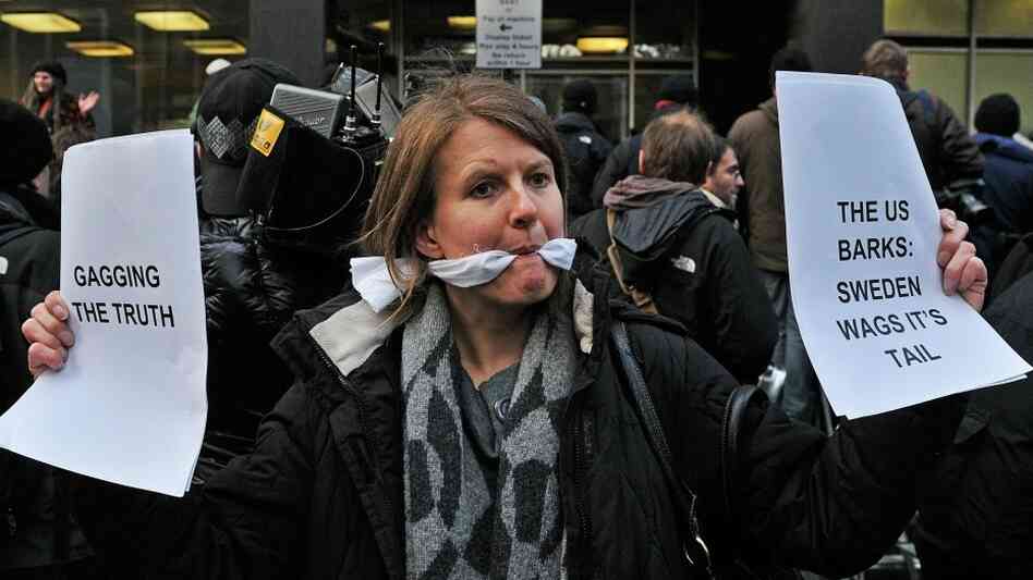 A gagged demonstrator holds placards A gagged demonstrator holds placards