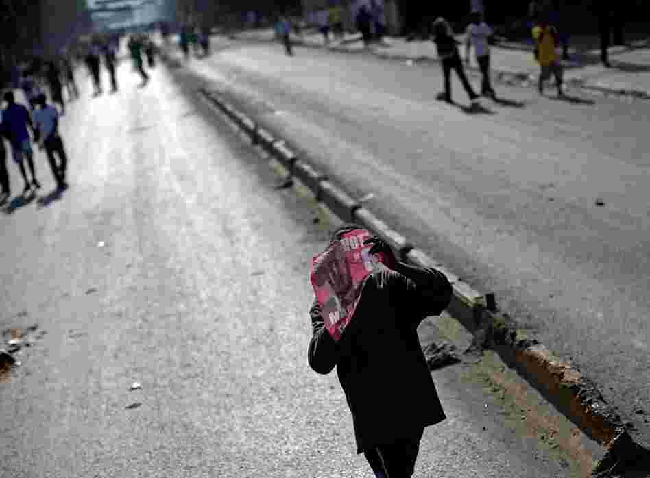 Black smoke from burning barricades was in the air Wednesday in areas where Martelly's support is strongest, including Petionville and Delmas. Thousands were on the streets chanting, "Micky," and singing political songs.