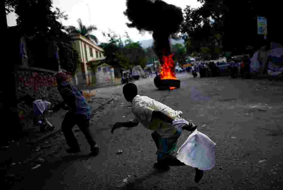 Protestors block the road in Petionville, a suburb of Port-au-Prince. Thousands of protesters demonstrated across Haiti on Wednesday over what they claim are rigged results of the Nov. 28 presidential election.