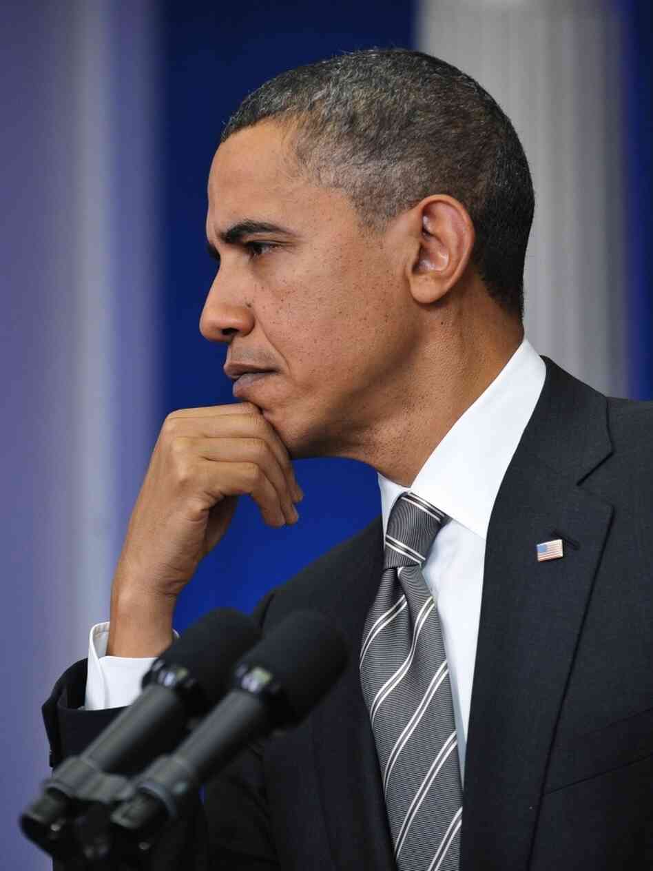 Obama listens to reporter Obama listens to reporter