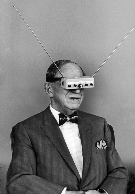Inventor Hugo Gernsback demonstrates "TV Glasses" for television on the go. Take that, iPhone. 