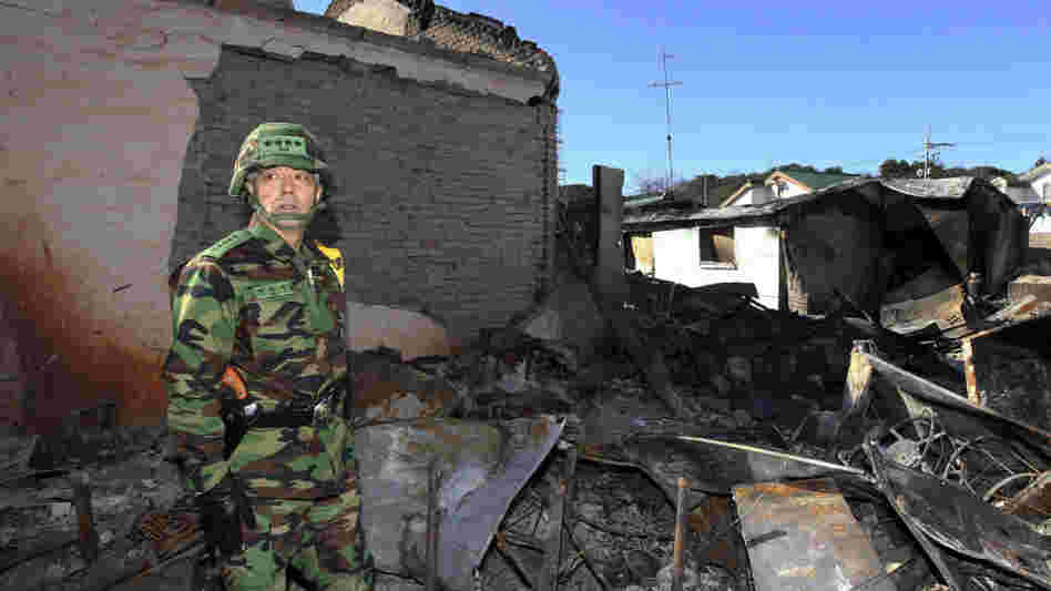 South Korean Gen. Han Min-koo looks at houses destroyed by North Korean shelling on Yeonpyeong Island. South Korean Gen. Han Min-koo looks at houses destroyed by North Korean shelling on Yeonpyeong Island.
