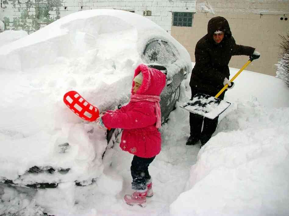 Dec. 2, 2010: Lilly and Tara Schweikhard dig out in Buffalo. Dec. 2, 2010: Lilly and Tara Schweikhard dig out in Buffalo.