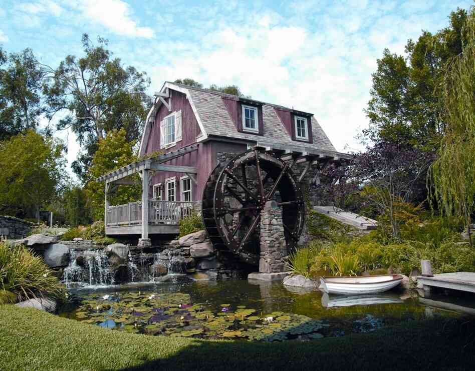 Barbra Streisand chronicles the creation and construction of her newest home in her book My Passion for Design. Seen here, the Mill House on her property has a working water wheel over a man-made pond. 