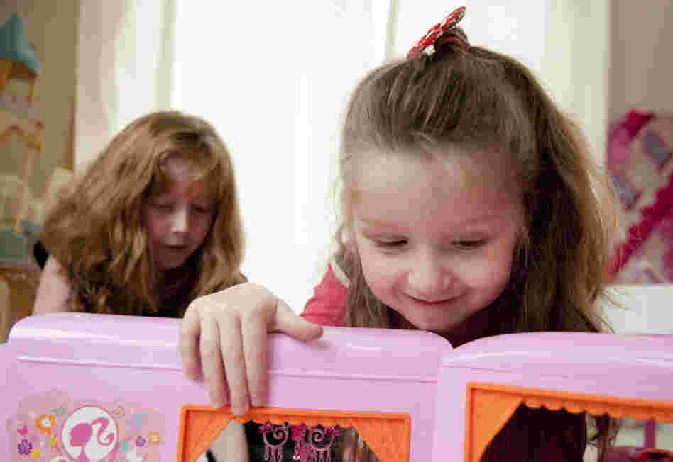 Hannah plays with her sister, Madison. "They had told us that if this had happened to our eldest child, who was born five years prior, that this would not have even been an option," John says.
