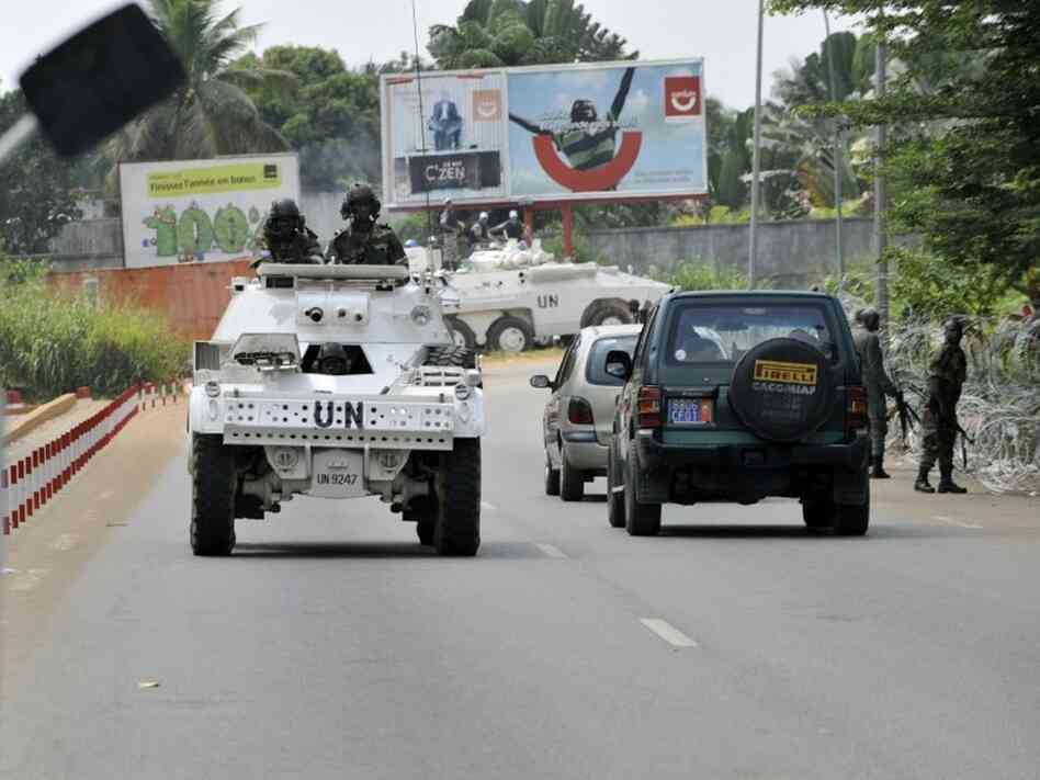U.N. peacekeepers patrol the front of the Golf Hotel in Abidjan, Ivory Coast. U.N. peacekeepers patrol the front of the Golf Hotel in Abidjan, Ivory Coast.