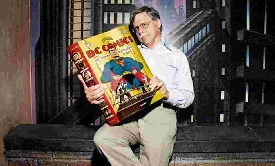 Author Paul Levitz holding "75 Years of DC Comics" Author Paul Levitz holding "75 Years of DC Comics"