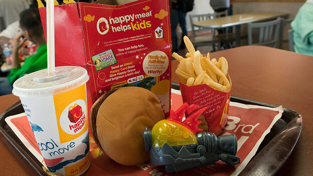The promise of the latest toy is a big allure for kids at McDonald's